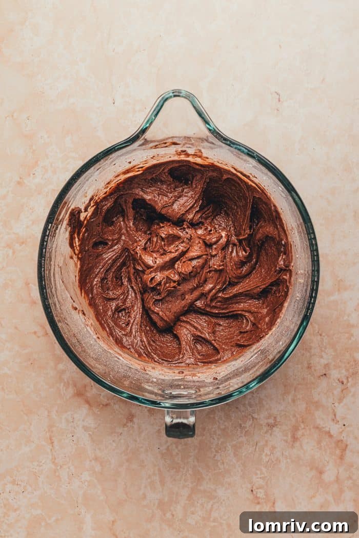 The fully mixed chocolate whoopie pie batter, smooth and rich, ready for scooping onto baking sheets.