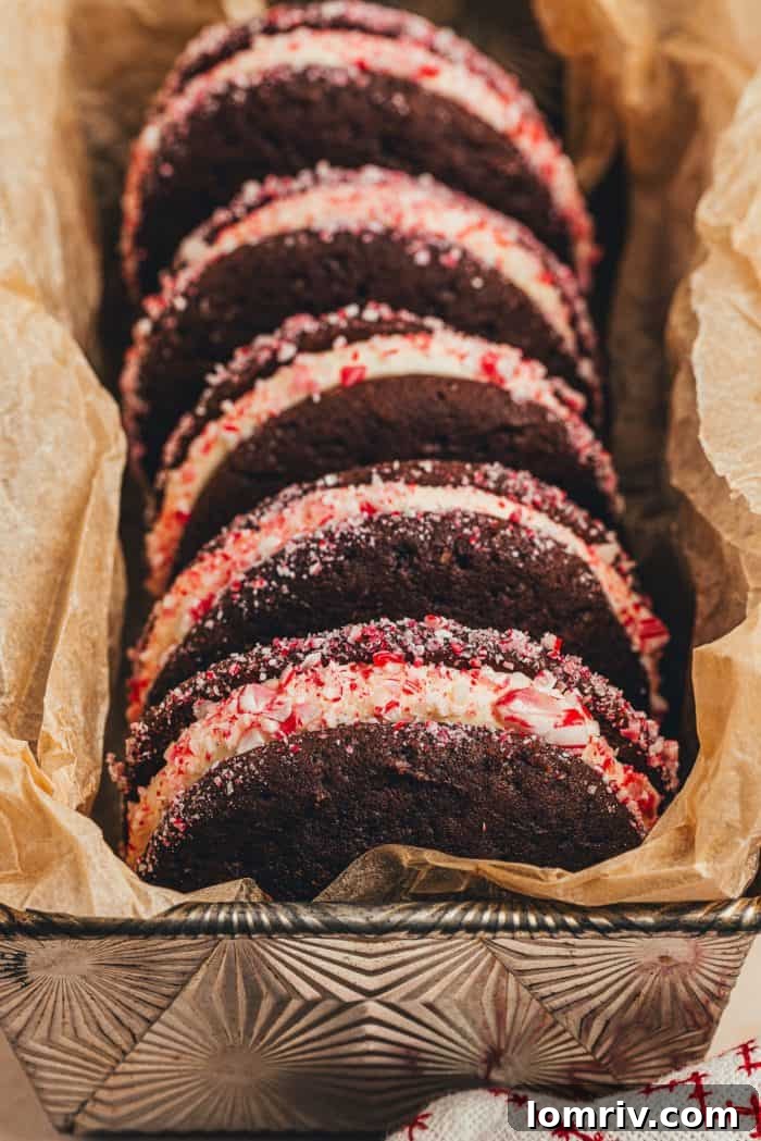 Four exquisite chocolate peppermint whoopie pies, showcasing their festive garnish.
