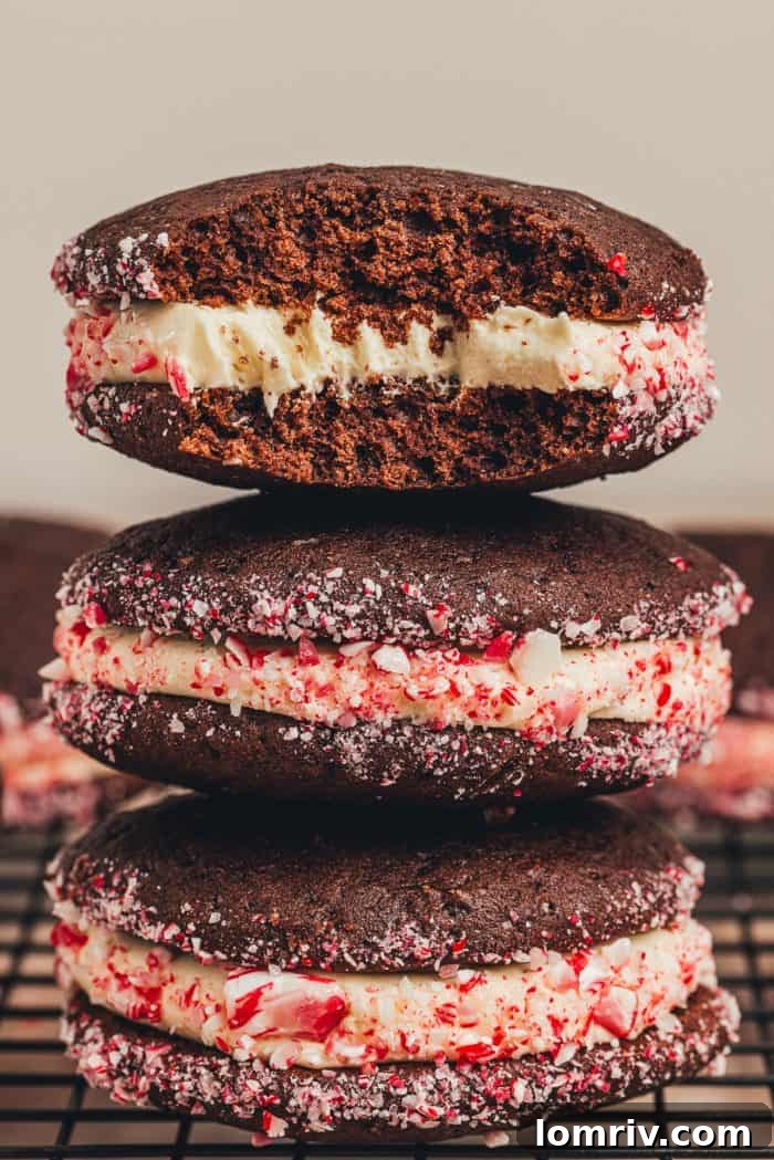 A trio of festive chocolate peppermint whoopie pies adorned with crushed candy canes.