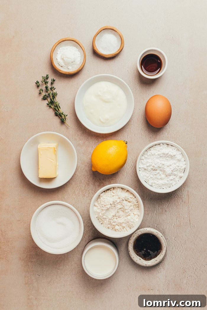 An array of small bowls neatly displaying all the essential ingredients required to bake a delicious lemon pound cake, ready for preparation.