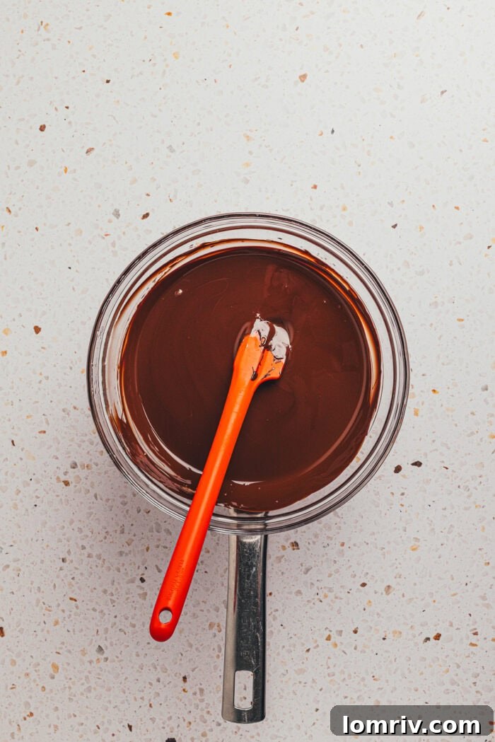 The chocolate coating mixture melted in a saucepan.