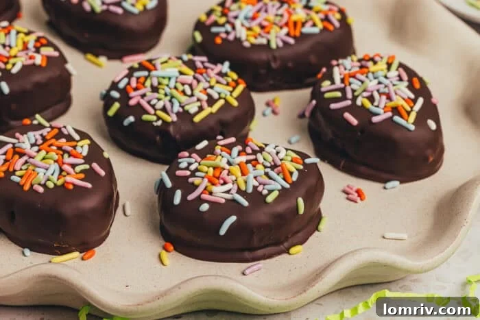 A few homemade chocolate Easter eggs scattered on a plate.
