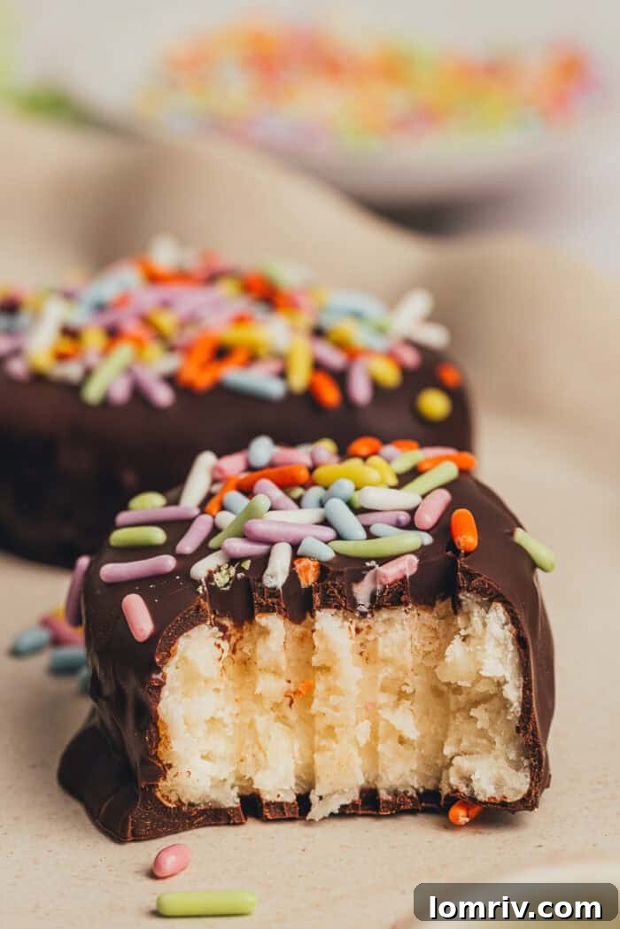 A homemade chocolate Easter egg is split in half on a small plate.
