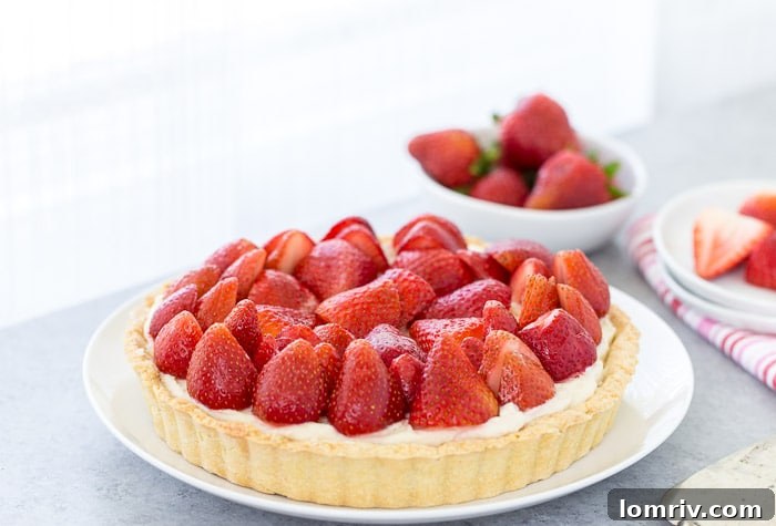 A close-up view of the perfectly baked, golden-brown tart crust, showcasing its delicate texture before the filling is added.