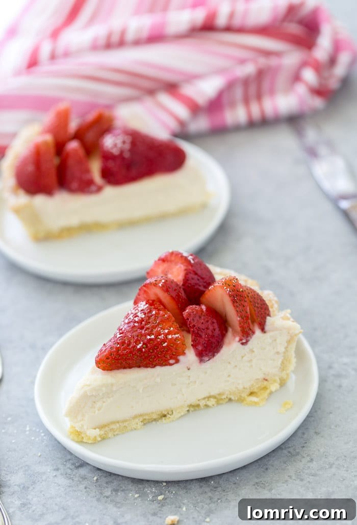The rich and creamy lemon mascarpone filling, generously spread into the baked tart shell, ready for its strawberry topping.