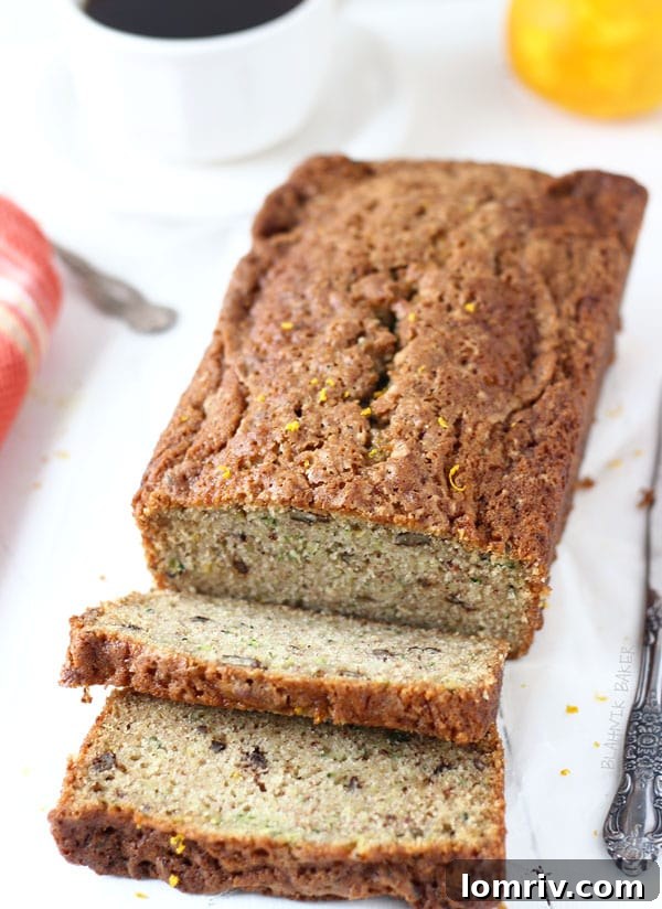 Freshly baked Orange Zucchini Bread cooling on a rack, filling the kitchen with a sweet aroma