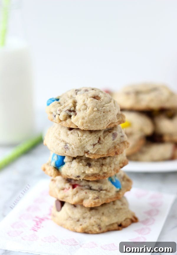 Close-up of freshly baked Spiced M&M Toffee Cookies, showcasing their soft texture and colorful additions