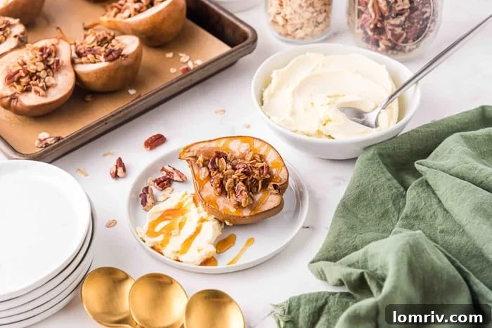 Baked pear halves with mascarpone and honey on a white plate, ready for a dessert