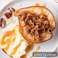 Baked pears on a plate with mascarpone and honey