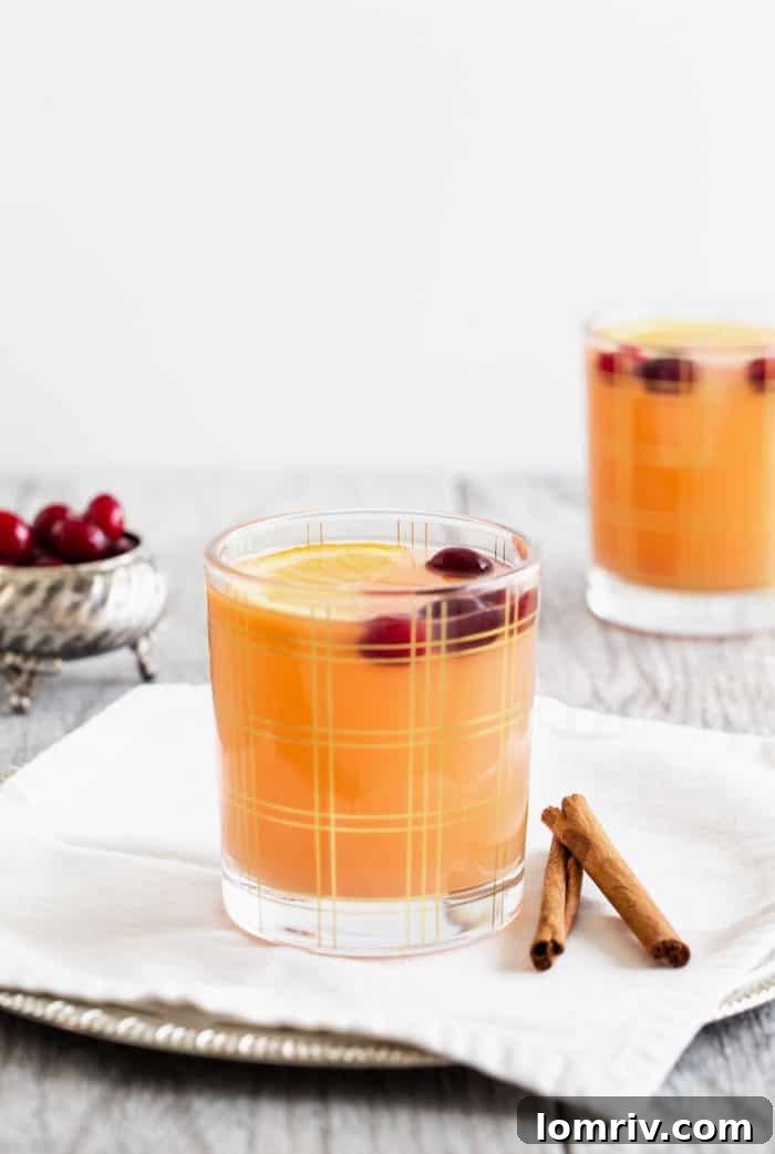 Multiple glasses of Cinnabon Vodka Brunch Punch, ready to be served at a festive gathering.