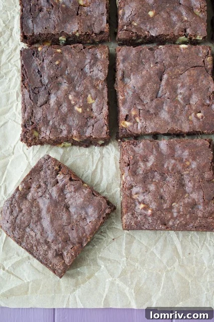 Rich, fudgy Brown Butter Walnut Brownies with a delightful crinkly top, cooling on a wire rack.