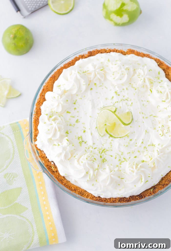 This no bake frozen margarita pie recipe is sweet, tangy and refreshing. Creamy cream cheese and tart lime juice in the perfect summer pie. 