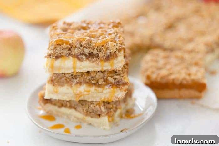 A triple layer of apples, cheesecake and crumb coat make these apple crumble cheesecake bars a different take on a classic fall dessert.