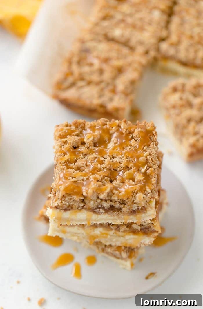 A triple layer of apples, cheesecake and crumb coat make these apple crumble cheesecake bars a different take on a classic fall dessert.