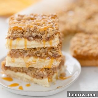 A triple layer of apples, cheesecake and crumb coat make these apple crumble cheesecake bars a different take on a classic fall dessert.