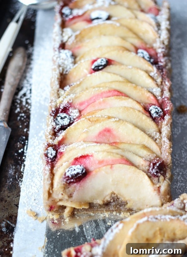 Gluten-Free Apple Almond Tart - a slice ready to be served with ice cream