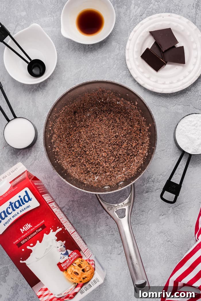 Dark chocolate melting in a saucepan with milk for hot cocoa