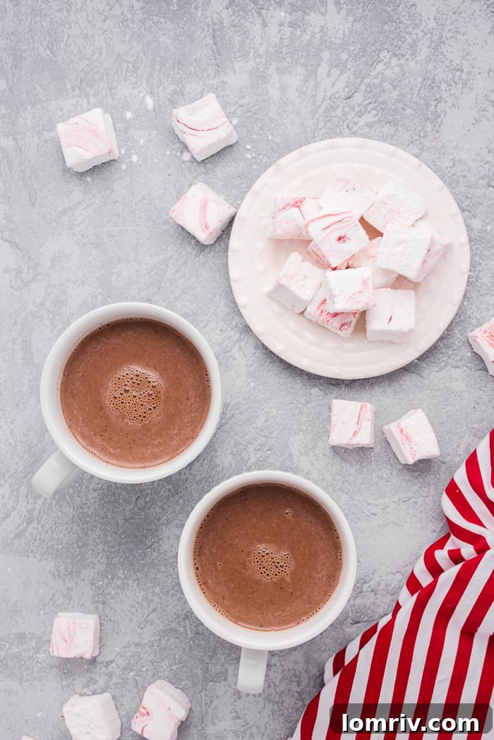 Homemade peppermint hot cocoa topped with fluffy marshmallows