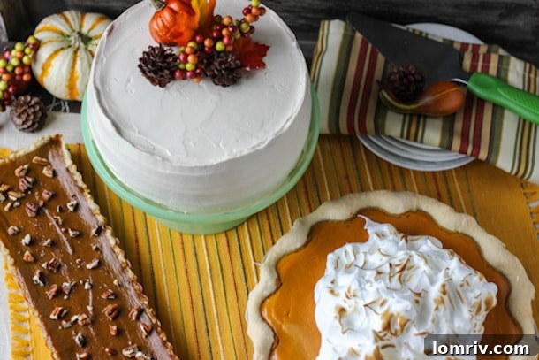 A stunning array of Thanksgiving desserts, featuring a spiced pumpkin cake, a sweet potato pie, and a pumpkin maple tart, artfully arranged on a holiday table.