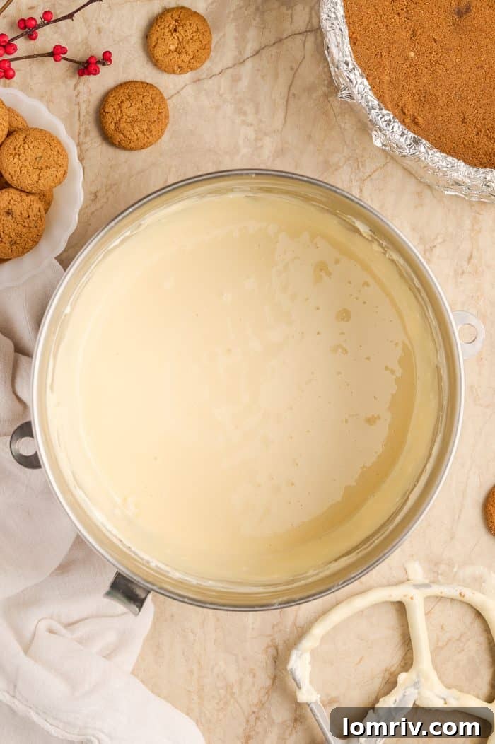 The smooth, creamy eggnog cheesecake filling in a bowl.