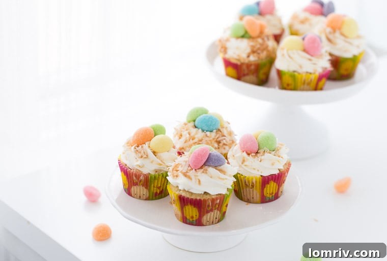 Fluffy coconut cupcakes topped with sweet whipped coconut frosting, a perfect treat for spring gatherings.