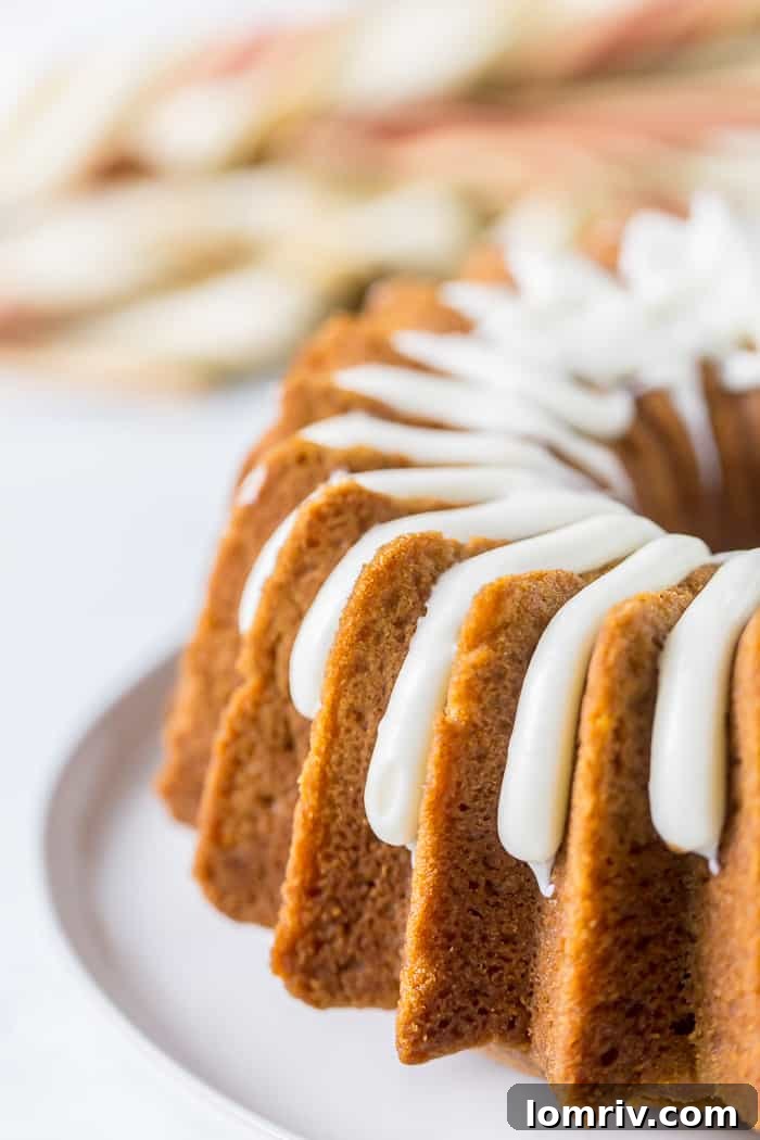 Pumpkin Bundt Cake with Bourbon Cream Cheese Icing Drizzled