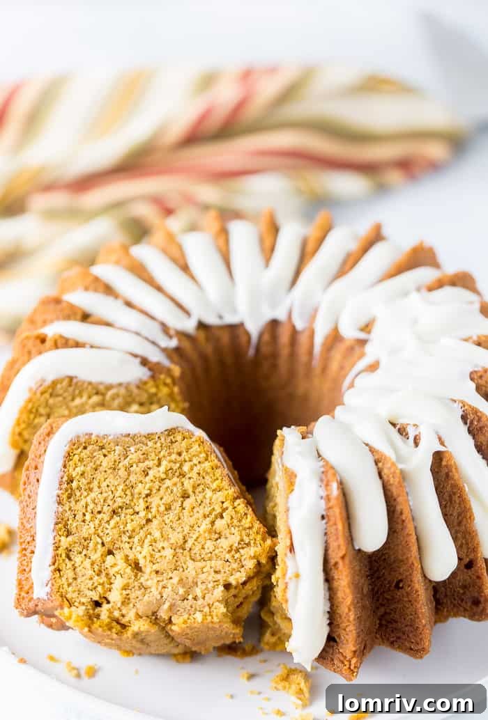 Close-up of Moist Pumpkin Bundt Cake Slice with Frosting