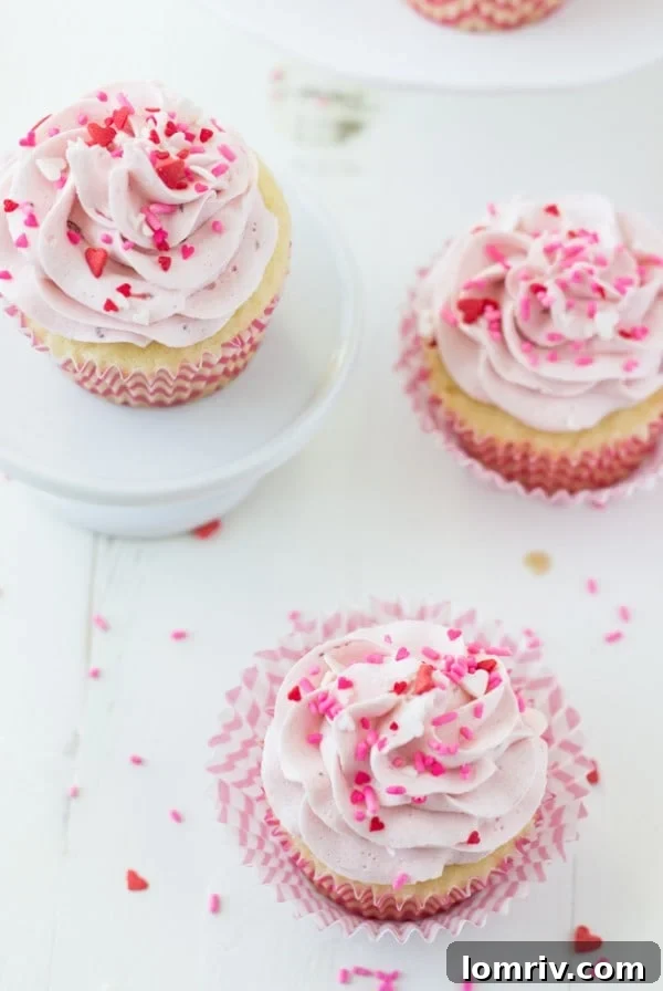Moist Vanilla Cupcakes with Fresh Strawberry Mascarpone Frosting, perfect for any celebration