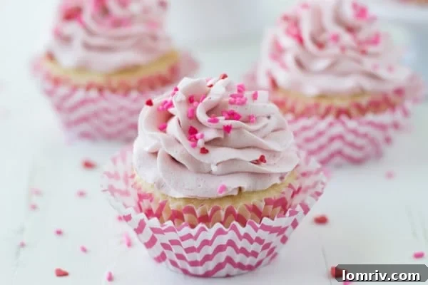 Closeup of fluffy Strawberry Mascarpone Frosting on Vanilla Cupcakes
