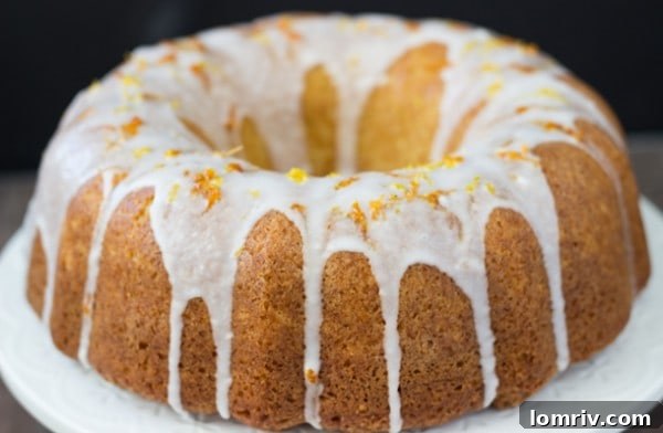 Grapefruit-Orange-Pound Cake: A vibrant and colorful flat lay featuring a slice of cake, fresh grapefruits, and orange, emphasizing the freshness of the ingredients.