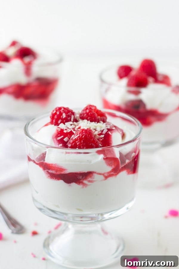 Luminous White Chocolate Raspberry Parfaits in elegant glasses, ready for serving