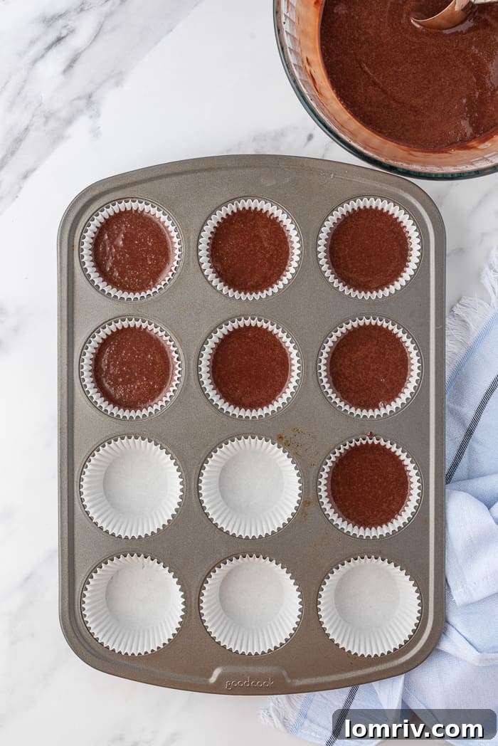 Cupcake liners filled with chocolate batter