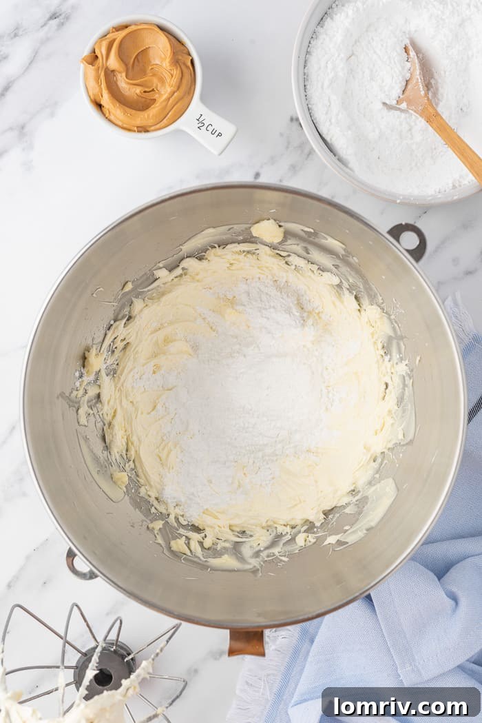 Unsalted butter being creamed for frosting