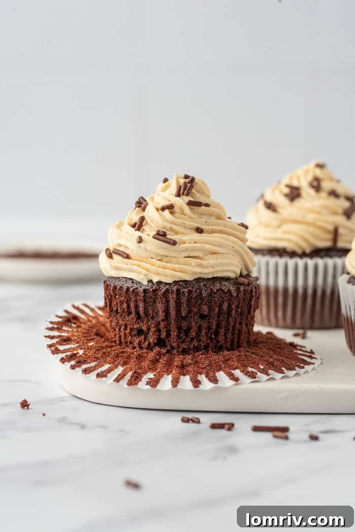 Chocolate Cupcakes with Peanut Butter Buttercream on a cake stand