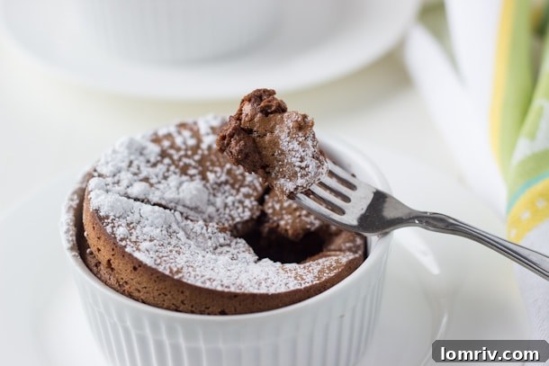 Finished Chocolate Almond Souffle sprinkled with powdered sugar, ready to be served.