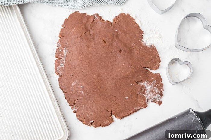Dough rolled out between parchment paper