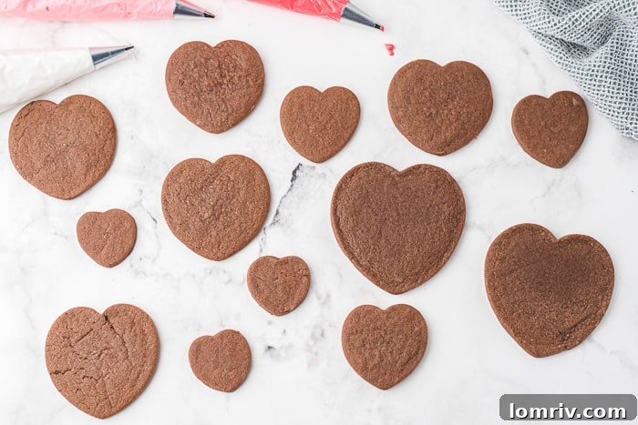 Baked chocolate heart cookies cooling on a rack