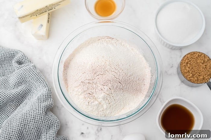 Sifting dry ingredients for chocolate heart cookies
