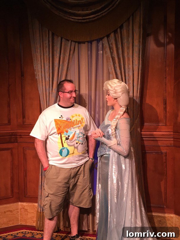 Mr. J meeting Elsa while wearing his Olaf shirt at Disney World, a memorable character encounter.
