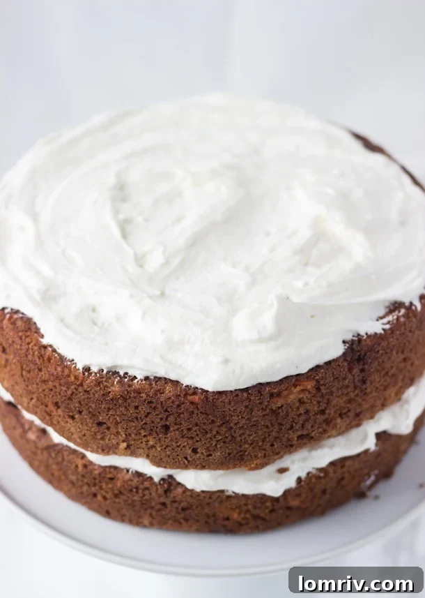 Classic Carrot Cake Recipe adorned with a luscious Ginger Cream Cheese Frosting, highlighting its incredible moisture, rich spices, and perfect texture.