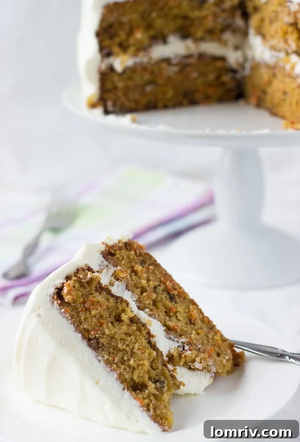 The ultimate Homemade Carrot Cake, featuring a golden crumb, crunchy walnuts, and an irresistible Ginger Cream Cheese Frosting. A perfect dessert for all seasons.
