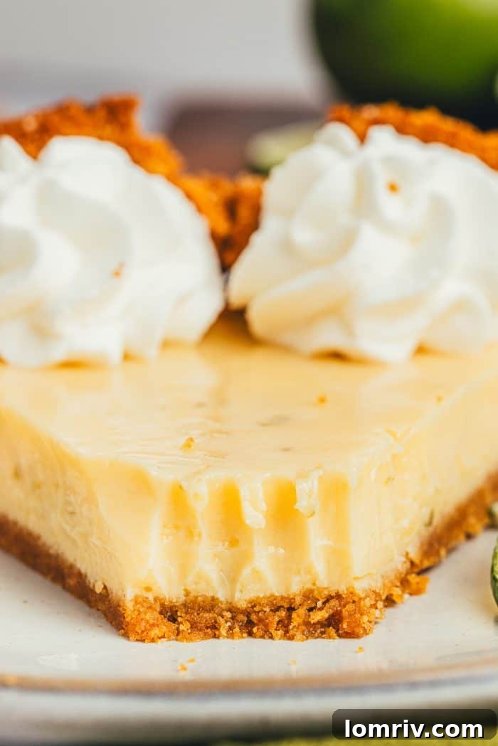 A pristine Key Lime Pie, still in its dish, waiting to be sliced and enjoyed.