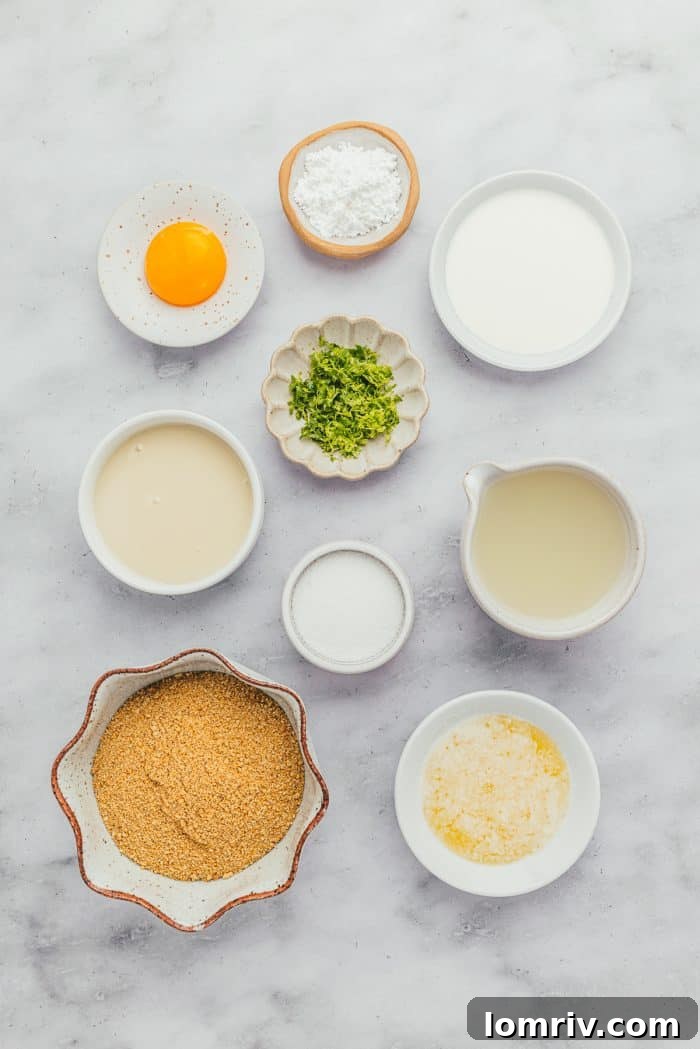 All the fresh ingredients for Key Lime Pie laid out in small bowls, ready for preparation.
