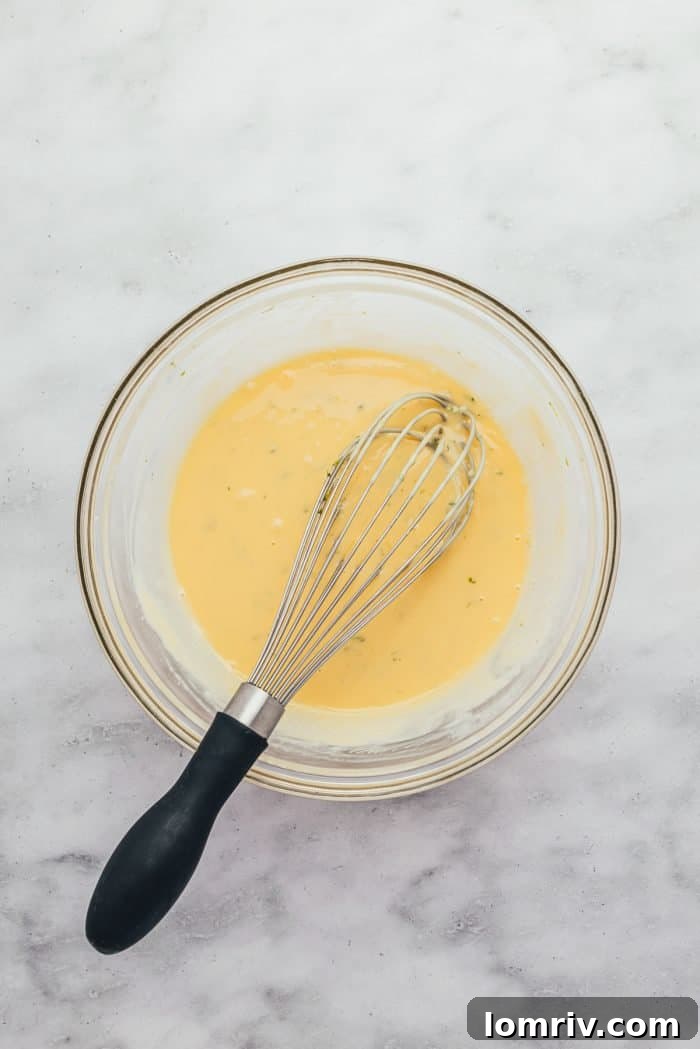 The Key Lime Pie filling, now with key lime juice and zest, being whisked to perfection.