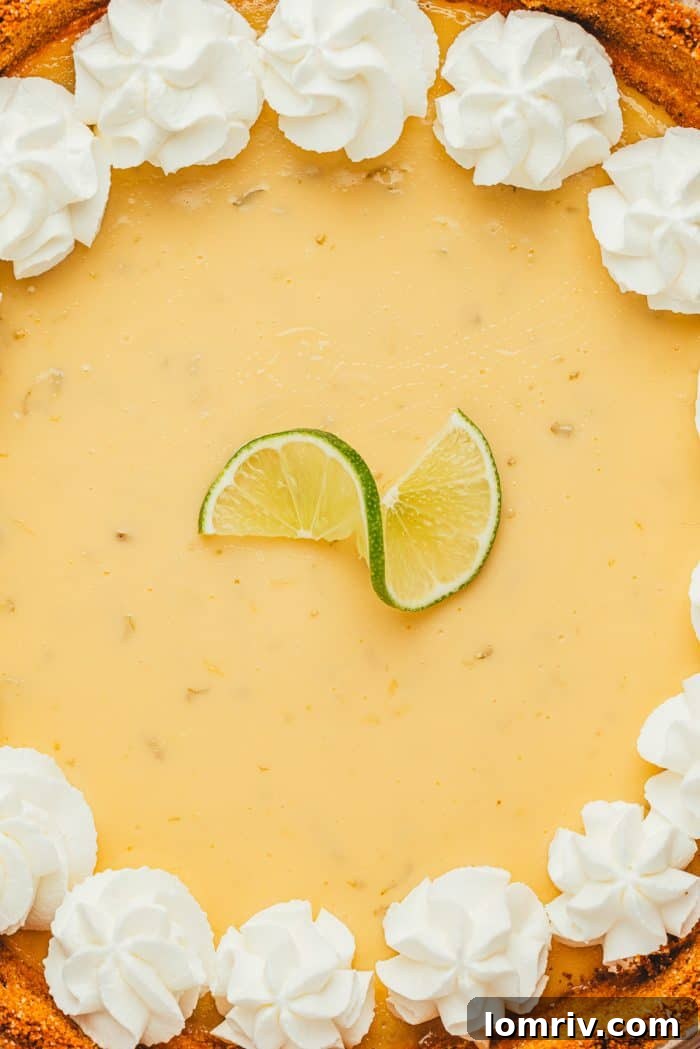 The smooth, creamy texture of a Key Lime Pie's filling, showcasing its delicate color and perfect set.