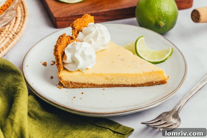 Another view of a delicious slice of Key Lime Pie, emphasizing its creamy texture and golden crust.