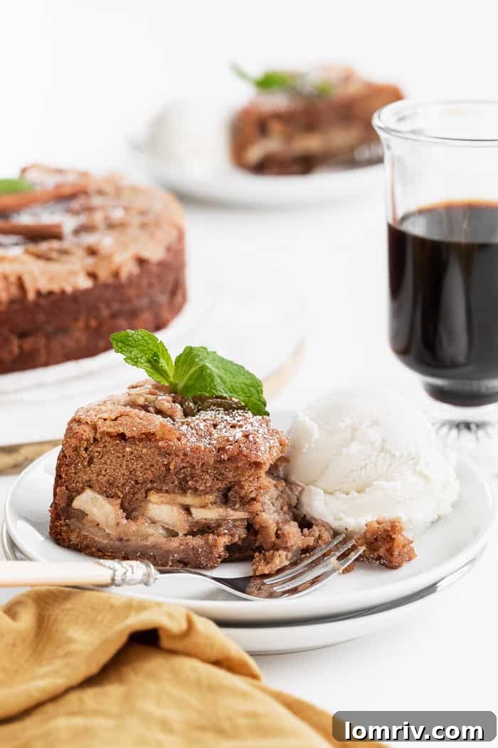 Slice of Brown Butter Ginger Apple Torte with caramelized apples