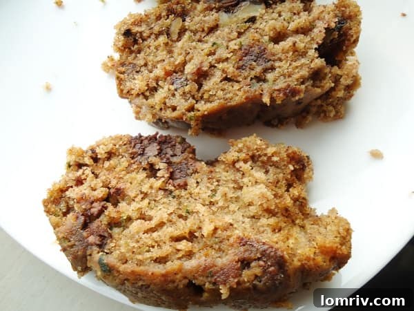 Two loaves of Zucchini Chocolate Chip Bread cooling on a wire rack