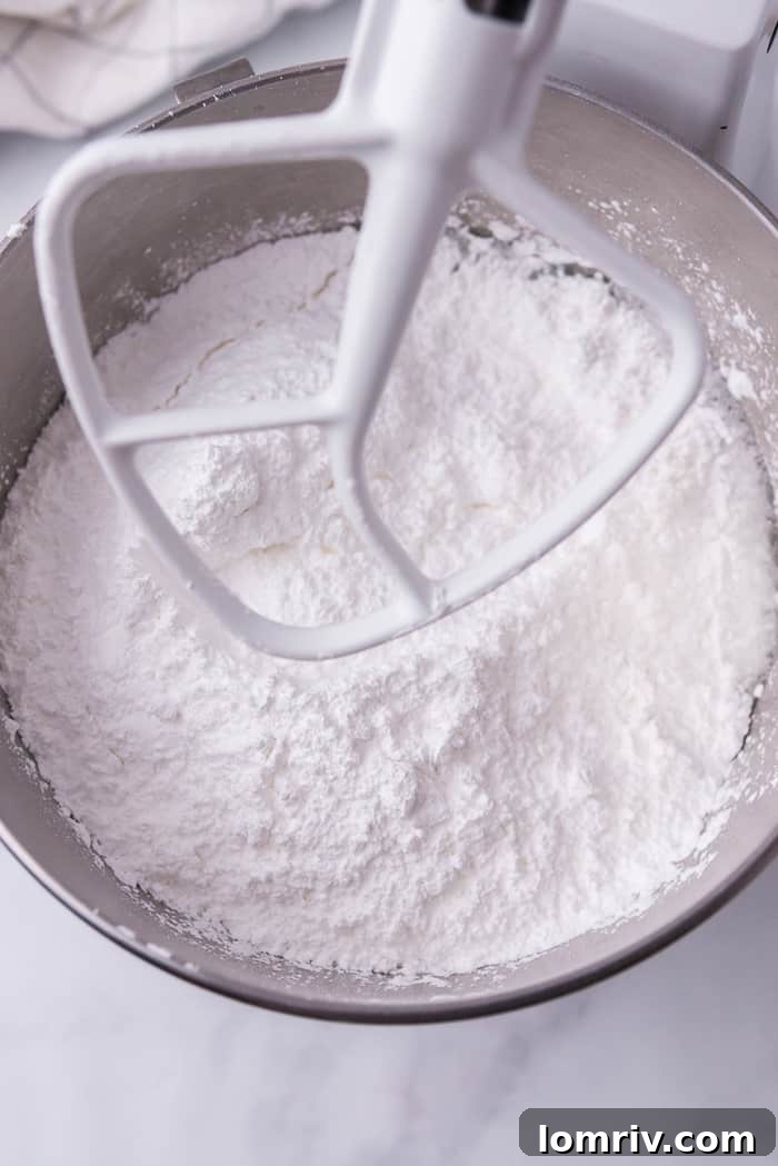 Mixing Meringue Powder, Water, and Cream of Tartar