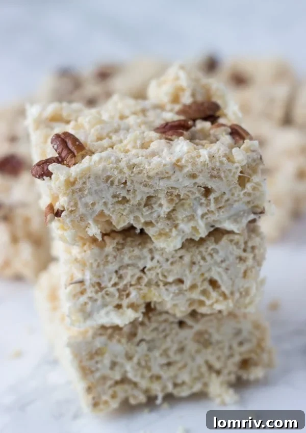 Close-up of freshly made Rice Krispie Treats with visible pecans